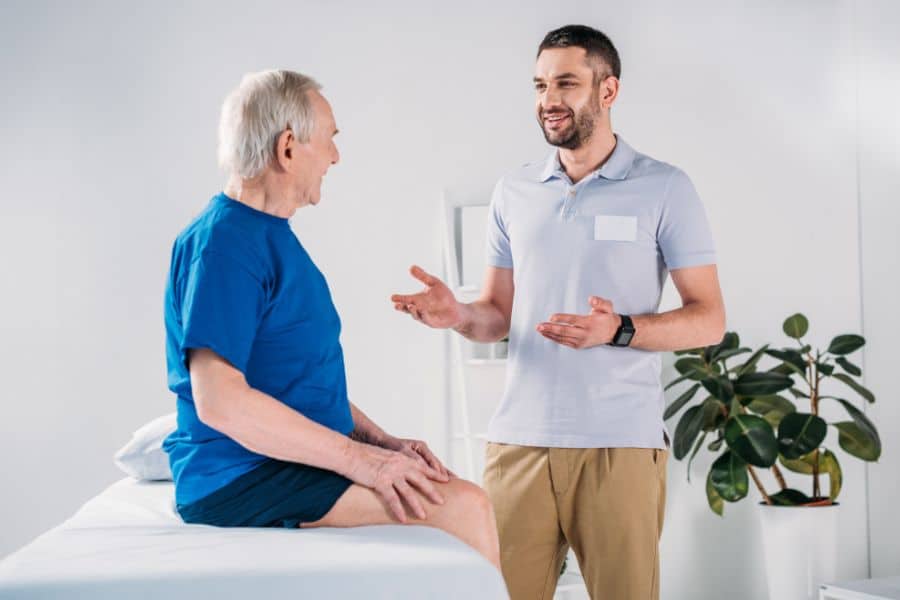 Massage Therapist Talking to Client